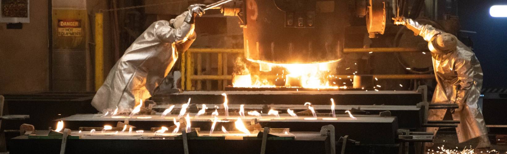 Two men working at a foundry