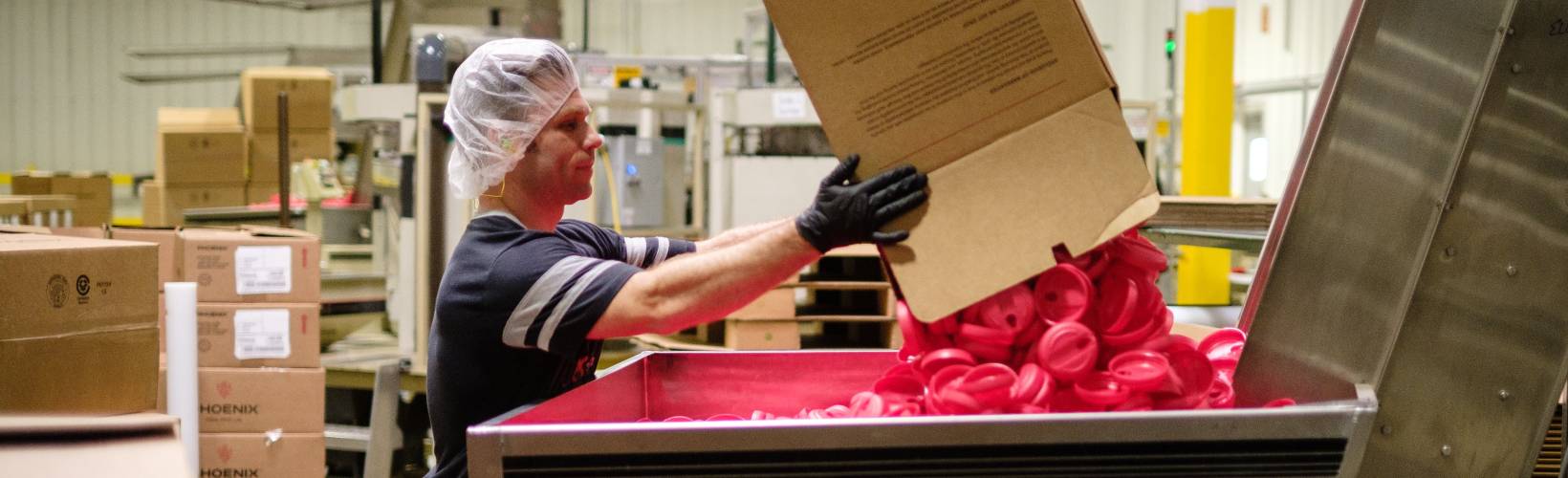 A man loading a machine